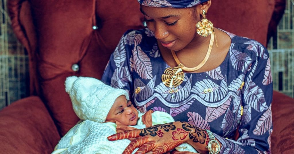 New mother holding her newborn baby